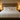 King size wooden bed with upholstered headboard